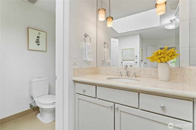 22309 1st Dr SE, Bothell, WA 98021 - bathroom with vanity, toilet, backsplash, and tile patterned floors