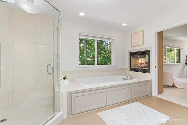 22309 1st Dr SE, Bothell, WA 98021 - full bathroom featuring a bath, a shower stall, tile patterned flooring, a tiled fireplace, and recessed lighting