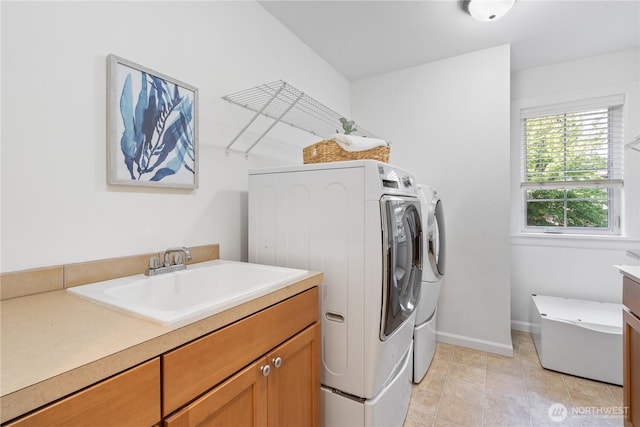 22309 1st Dr SE, Bothell, WA 98021 - laundry room featuring washer and dryer, a sink, light tile patterned floors, and baseboards