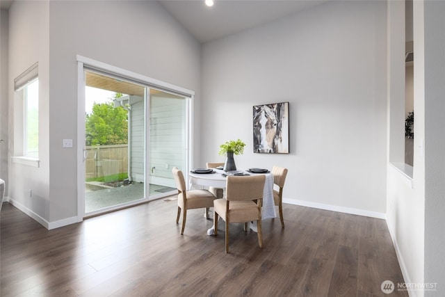 dining area with dark wood finished floors, baseboards, and recessed lighting