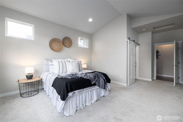 carpeted bedroom with a barn door, vaulted ceiling, and baseboards