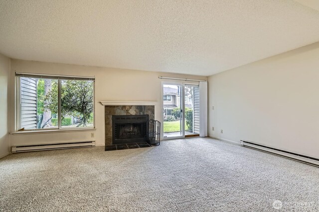 23723 12th Pl S Unit 2005, Des Moines, WA 98198 - unfurnished living room with a baseboard radiator, a textured ceiling, a fireplace, and carpet