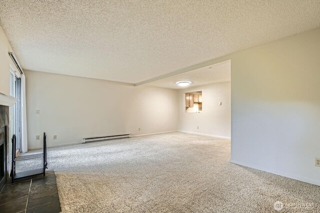 23723 12th Pl S Unit 2005, Des Moines, WA 98198 - unfurnished living room featuring a baseboard radiator, a fireplace with flush hearth, dark colored carpet, a textured ceiling, and baseboards