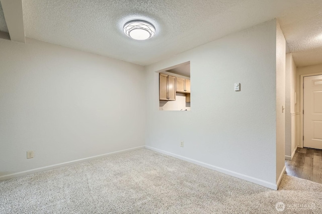 23723 12th Pl S Unit 2005, Des Moines, WA 98198 - carpeted empty room featuring a textured ceiling and baseboards