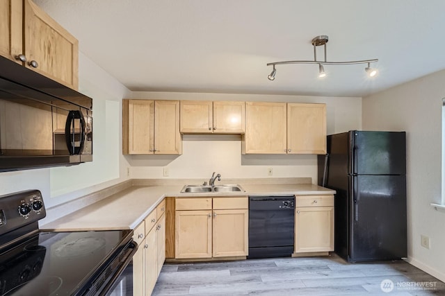 23723 12th Pl S Unit 2005, Des Moines, WA 98198 - kitchen with black appliances, a sink, light brown cabinetry, and light countertops