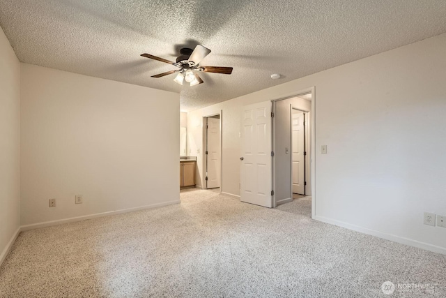 23723 12th Pl S Unit 2005, Des Moines, WA 98198 - unfurnished bedroom with light colored carpet, baseboards, ceiling fan, and a textured ceiling
