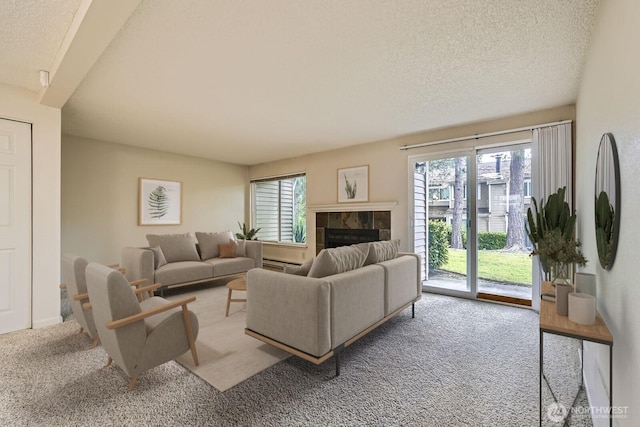 23723 12th Pl S Unit 2005, Des Moines, WA 98198 - carpeted living area featuring a tiled fireplace, a textured ceiling, and baseboard heating