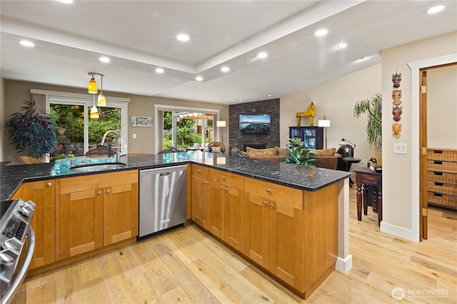 612 Kirkland Ave Unit A4, Kirkland, WA 98033 - kitchen with dishwasher, stove, light wood finished floors, recessed lighting, and a fireplace
