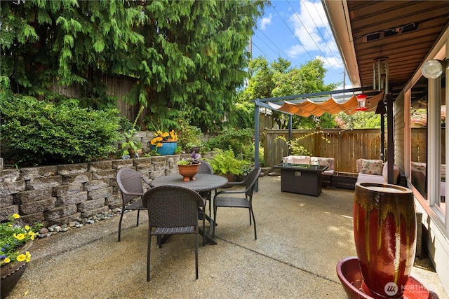 612 Kirkland Ave Unit A4, Kirkland, WA 98033 - fenced backyard with a pergola, outdoor dining area, and a patio area