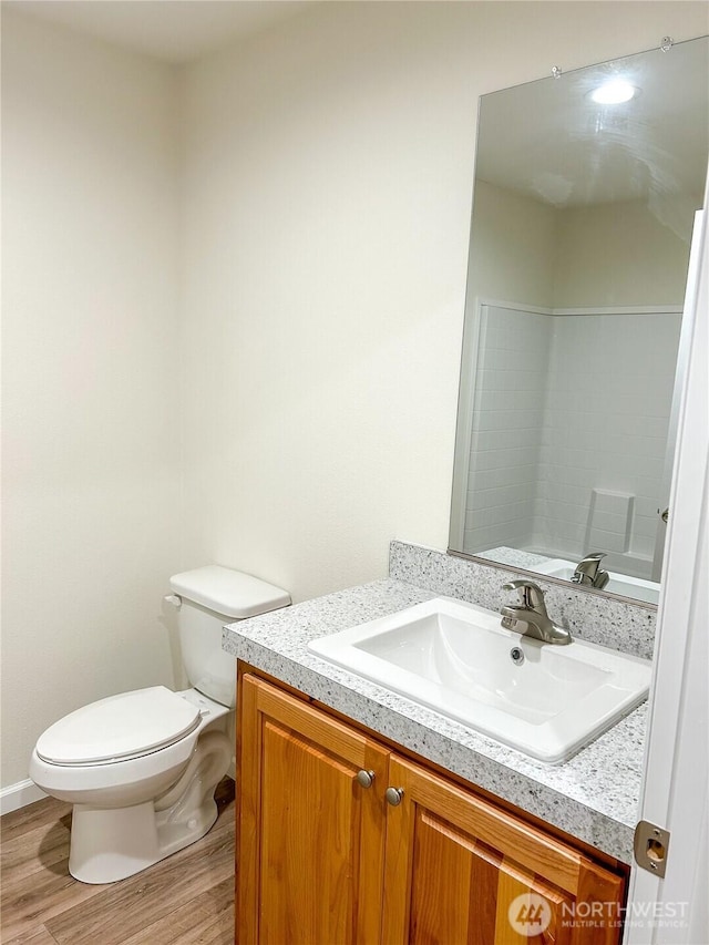2010 Front St Unit 33, Lynden, WA 98264 - bathroom featuring vanity, wood finished floors, and toilet