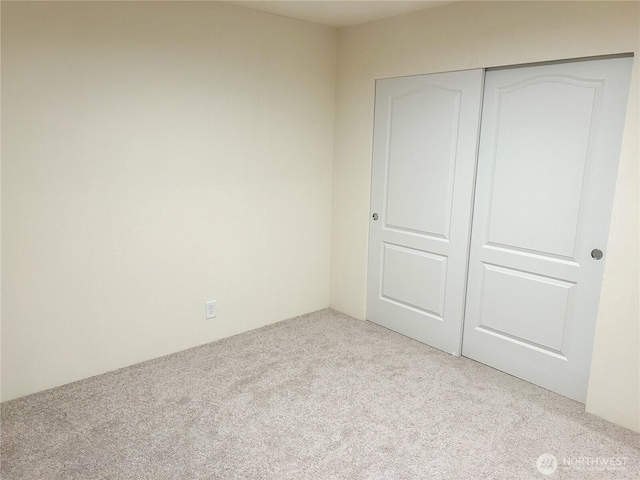 2010 Front St Unit 33, Lynden, WA 98264 - unfurnished bedroom featuring carpet and a closet