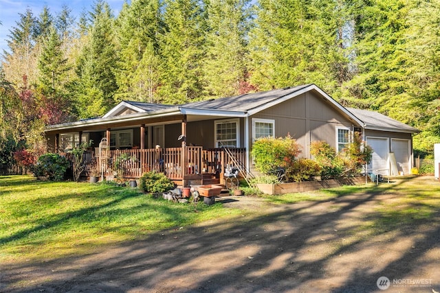 15010 NE 403rd St, Amboy, WA 98601 - ranch-style house featuring a porch, a front lawn, driveway, and a garage