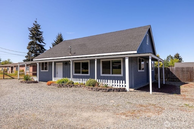 301 E Silberhorn Rd, Sequim, WA 98382 - country-style home with covered porch, fence, board and batten siding, brick siding, and roof with shingles
