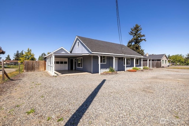 301 E Silberhorn Rd, Sequim, WA 98382 - view of front of property with driveway, fence, an attached garage, an attached carport, and a porch