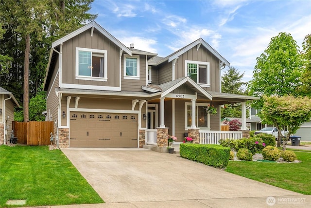 6503 Wrangler Dr SE, Tumwater, WA 98501 - craftsman inspired home with a porch, board and batten siding, an attached garage, and concrete driveway