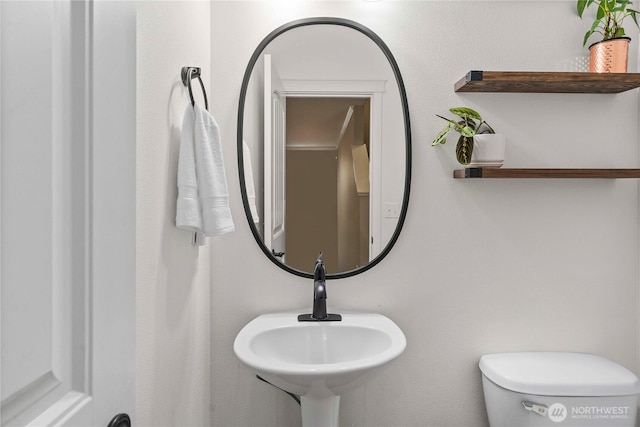 6503 Wrangler Dr SE, Tumwater, WA 98501 - half bath featuring a sink and toilet