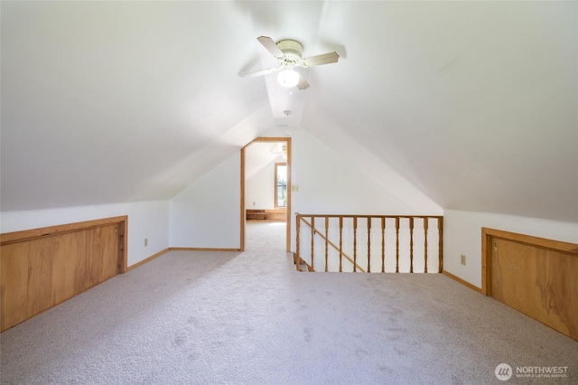 bonus room featuring ceiling fan, carpet, vaulted ceiling, and baseboards