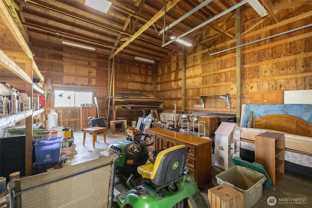 garage featuring wooden walls