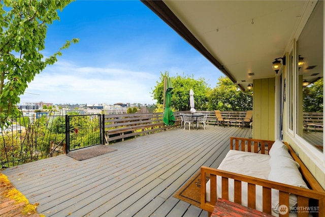 4808 38th Ave SW, Seattle, WA 98126 - wooden deck featuring outdoor dining space