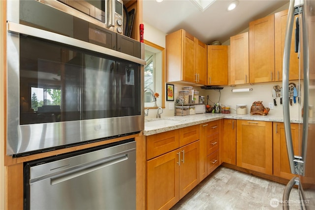 4808 38th Ave SW, Seattle, WA 98126 - kitchen featuring a sink, light wood-type flooring, light stone counters, recessed lighting, and dishwasher