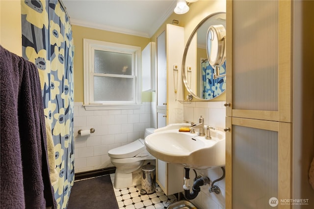 4808 38th Ave SW, Seattle, WA 98126 - full bath featuring toilet, crown molding, tile walls, wainscoting, and a sink
