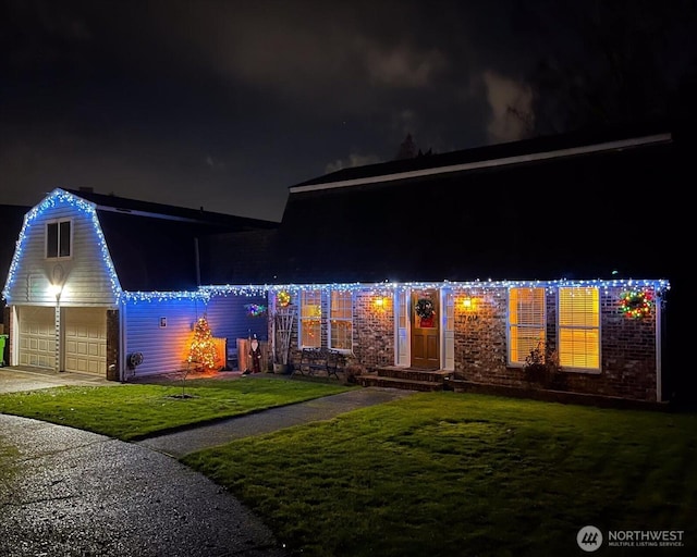17910 Spruce Way, Lynnwood, WA 98037 - view of front of house with a yard, a gambrel roof, and an attached garage