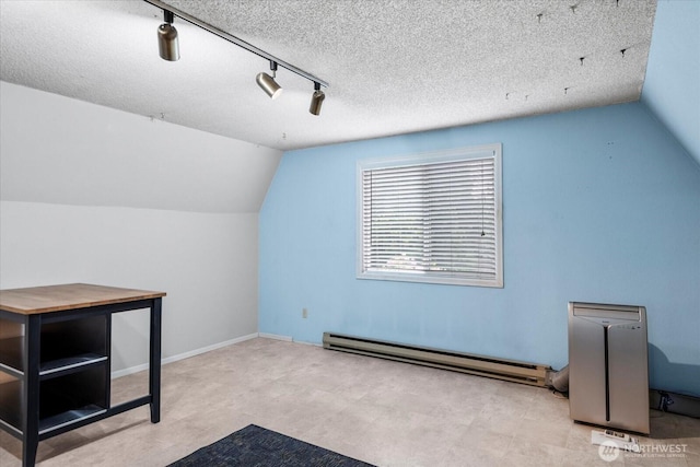 17910 Spruce Way, Lynnwood, WA 98037 - bonus room with a baseboard radiator, lofted ceiling, and a textured ceiling