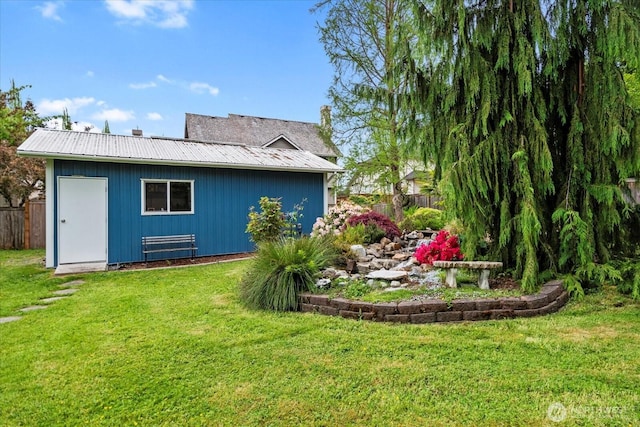 17910 Spruce Way, Lynnwood, WA 98037 - rear view of house featuring metal roof, an outbuilding, and board and batten siding