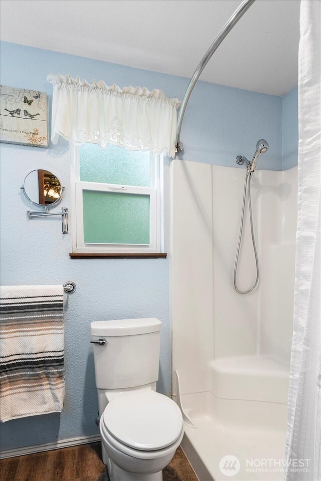 17910 Spruce Way, Lynnwood, WA 98037 - full bathroom featuring a shower with shower curtain, toilet, and wood finished floors