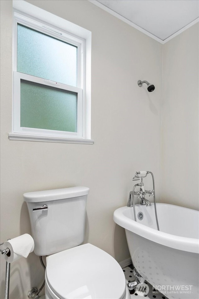 17910 Spruce Way, Lynnwood, WA 98037 - full bath with toilet, a freestanding bath, crown molding, and baseboards