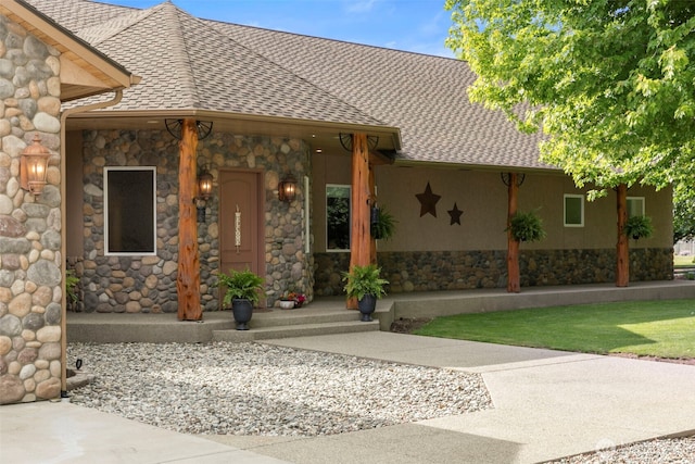 2720 NW Cascade Ave, East Wenatchee, WA 98802 - property entrance featuring stone siding, roof with shingles, and stucco siding