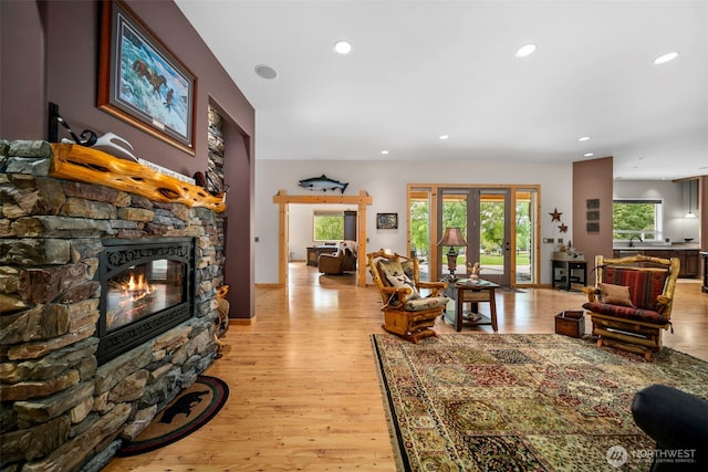 2720 NW Cascade Ave, East Wenatchee, WA 98802 - living area featuring a stone fireplace, recessed lighting, and light wood-style flooring