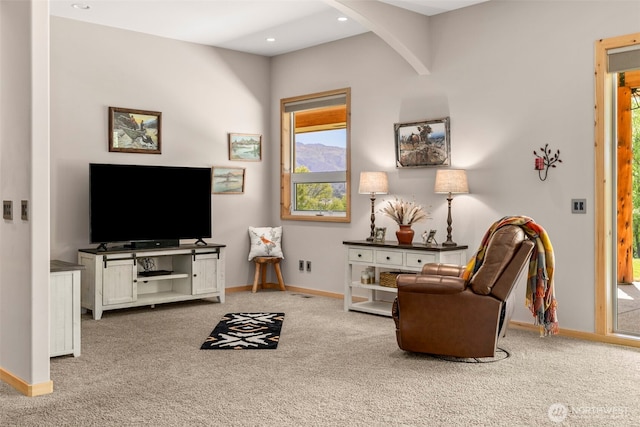 2720 NW Cascade Ave, East Wenatchee, WA 98802 - living area with carpet floors, baseboards, arched walkways, and recessed lighting