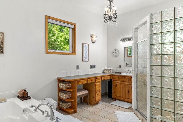 2720 NW Cascade Ave, East Wenatchee, WA 98802 - full bath featuring a shower stall, tile patterned flooring, vanity, a chandelier, and a bath