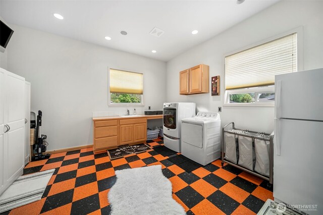 2720 NW Cascade Ave, East Wenatchee, WA 98802 - laundry room featuring cabinet space, separate washer and dryer, recessed lighting, and dark flooring