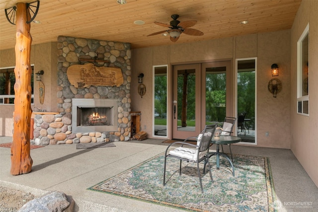 2720 NW Cascade Ave, East Wenatchee, WA 98802 - view of patio featuring an outdoor stone fireplace, french doors, and a ceiling fan