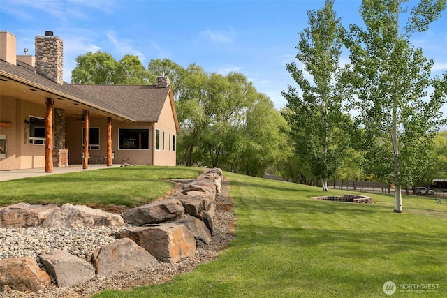 2720 NW Cascade Ave, East Wenatchee, WA 98802 - view of green lawn featuring a patio
