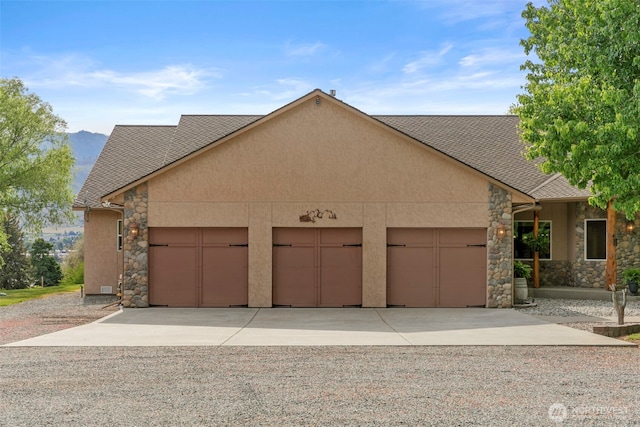 2720 NW Cascade Ave, East Wenatchee, WA 98802 - view of front facade featuring stone siding, stucco siding, driveway, and an attached garage