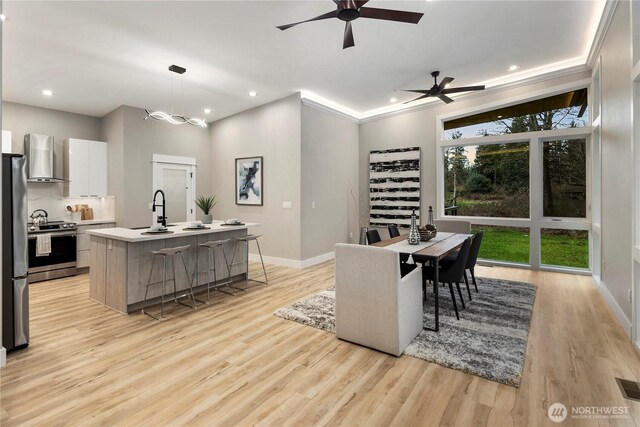 16250 SE Lake Moneysmith, Auburn, WA 98092 - dining space with baseboards, light wood-type flooring, recessed lighting, and a ceiling fan