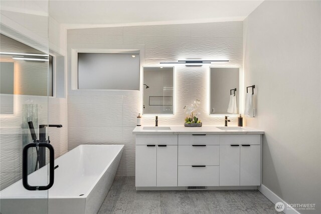 16250 SE Lake Moneysmith, Auburn, WA 98092 - full bathroom with double vanity, a freestanding tub, and baseboards