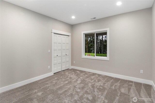 16250 SE Lake Moneysmith, Auburn, WA 98092 - unfurnished bedroom featuring carpet floors, baseboards, recessed lighting, and a closet