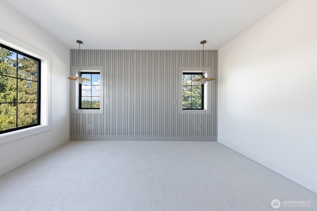 706 N 59th St, Seattle, WA 98103 - spare room featuring healthy amount of natural light, carpet flooring, and baseboards