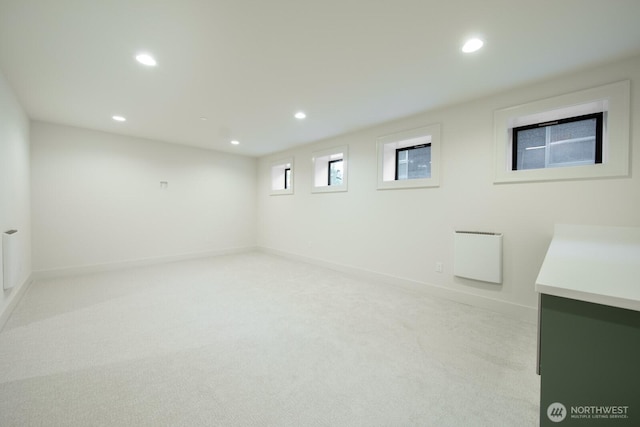 706 N 59th St, Seattle, WA 98103 - below grade area featuring recessed lighting, light carpet, and baseboards