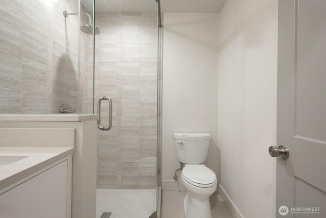 706 N 59th St, Seattle, WA 98103 - bathroom featuring a shower stall, tile patterned flooring, toilet, and vanity