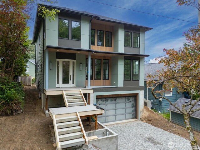 706 N 59th St, Seattle, WA 98103 - modern home featuring driveway, an attached garage, and stucco siding