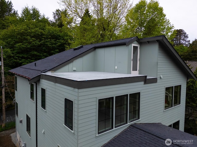 706 N 59th St, Seattle, WA 98103 - view of property exterior with board and batten siding