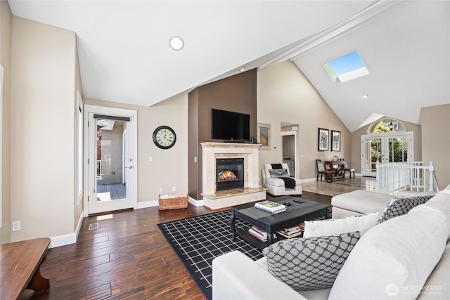 2815 211th Ave E, Lake Tapps, WA 98391 - living room with dark wood-style floors, a high end fireplace, a skylight, high vaulted ceiling, and french doors