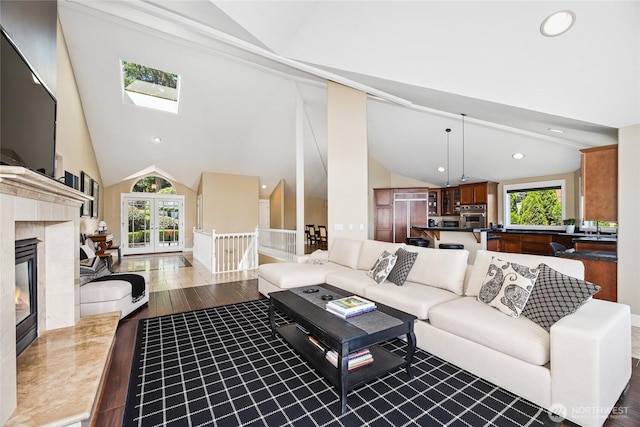 2815 211th Ave E, Lake Tapps, WA 98391 - living area with healthy amount of natural light, wood finished floors, a tile fireplace, a skylight, and recessed lighting