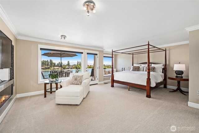 2815 211th Ave E, Lake Tapps, WA 98391 - bedroom featuring ornamental molding, access to exterior, light carpet, and a glass covered fireplace