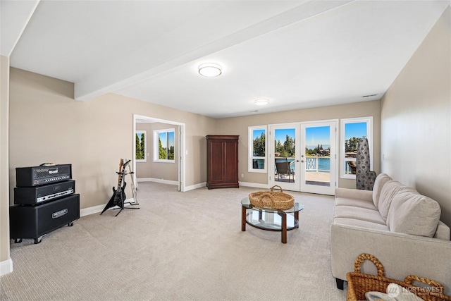 2815 211th Ave E, Lake Tapps, WA 98391 - living area featuring light carpet, beamed ceiling, and french doors